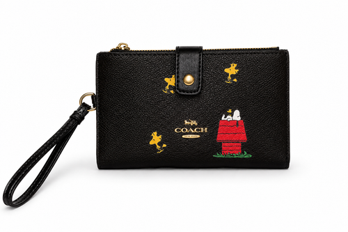 Coach x Peanuts Snoopy Woodstock wristlet black exterior