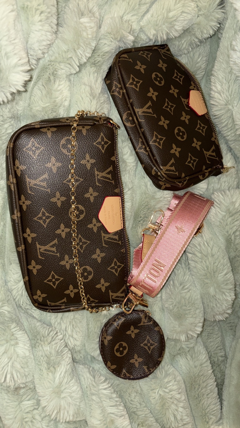 LV monogram multi pochette set flat lay with pink strap
