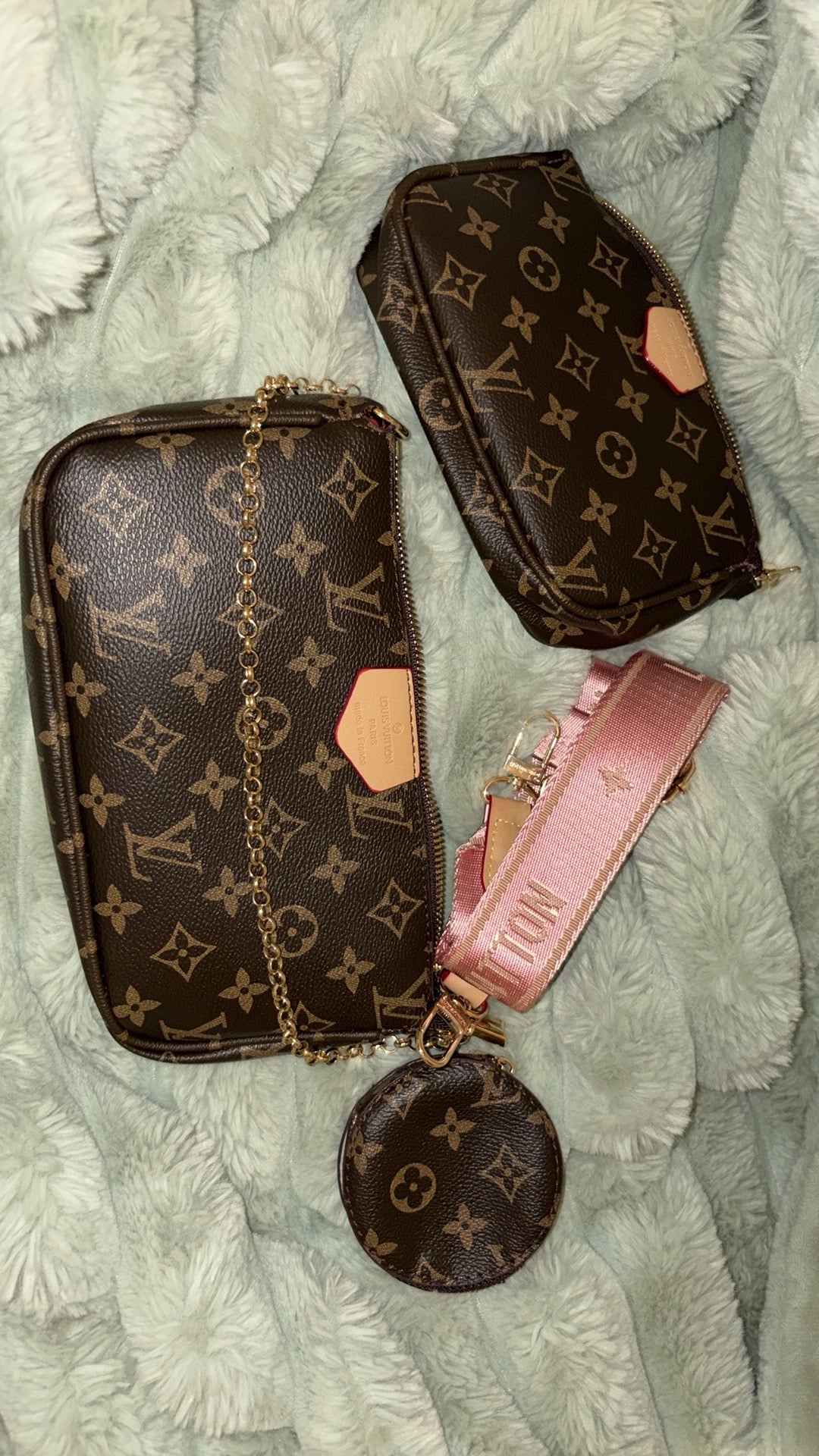 LV monogram multi pochette set flat lay with pink strap