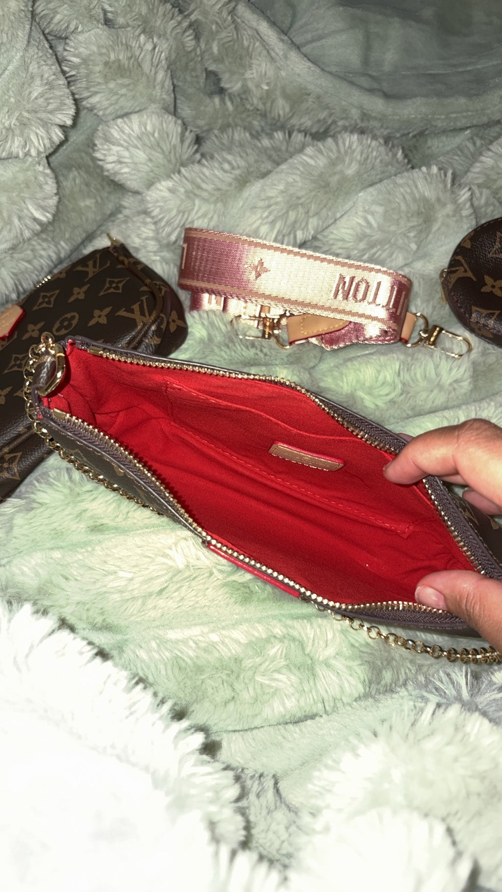 LV monogram pochette open showing red interior