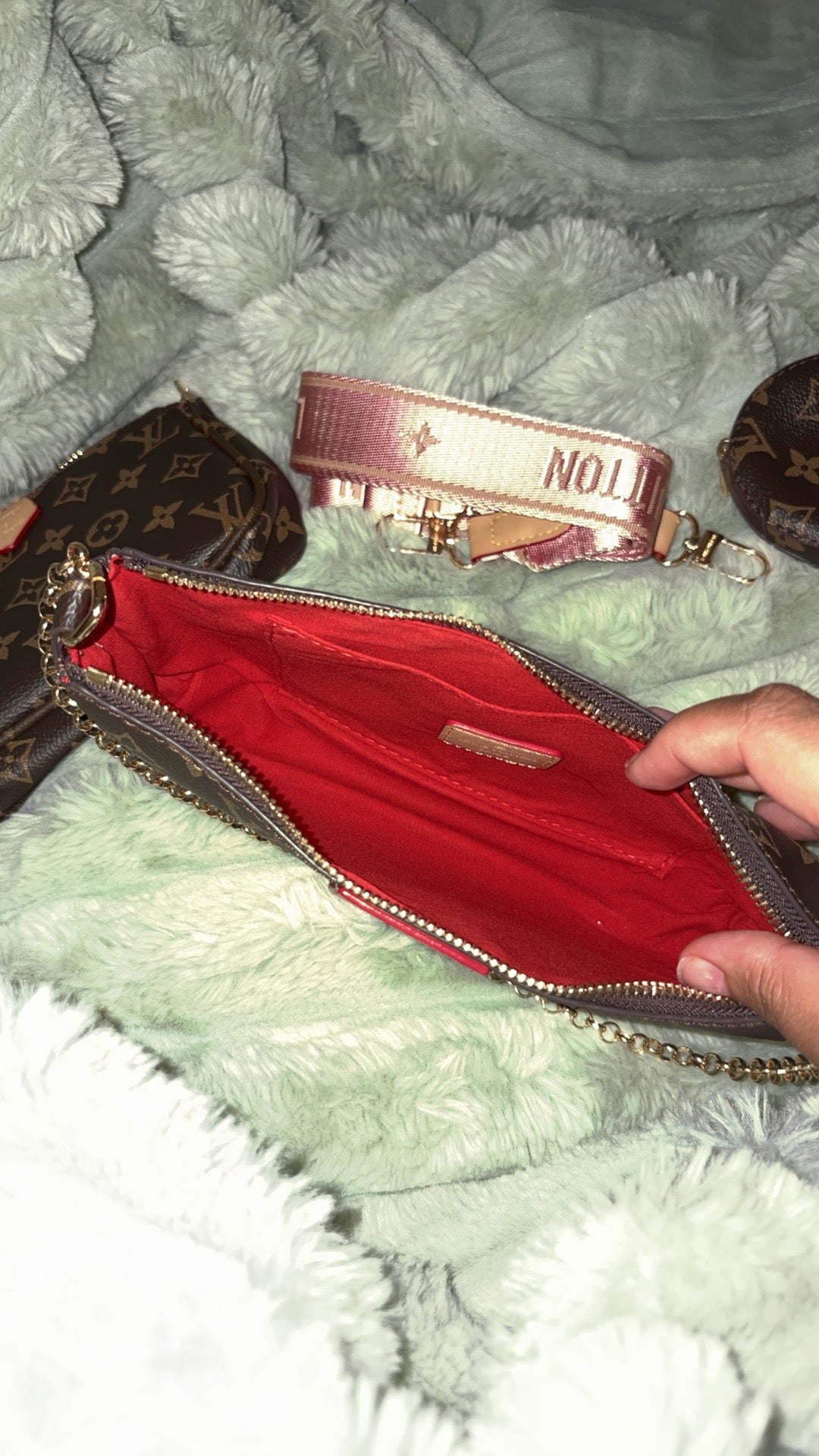 LV monogram pochette open showing red interior