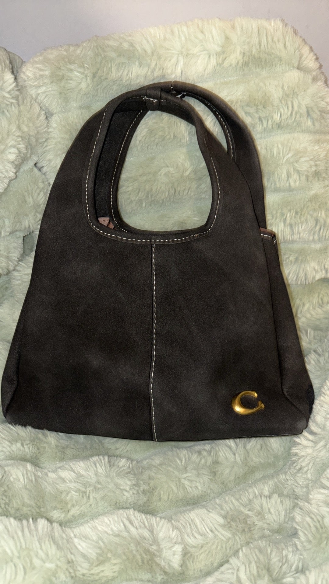 Coach Lana suede hobo bag dark chocolate brown on fur background