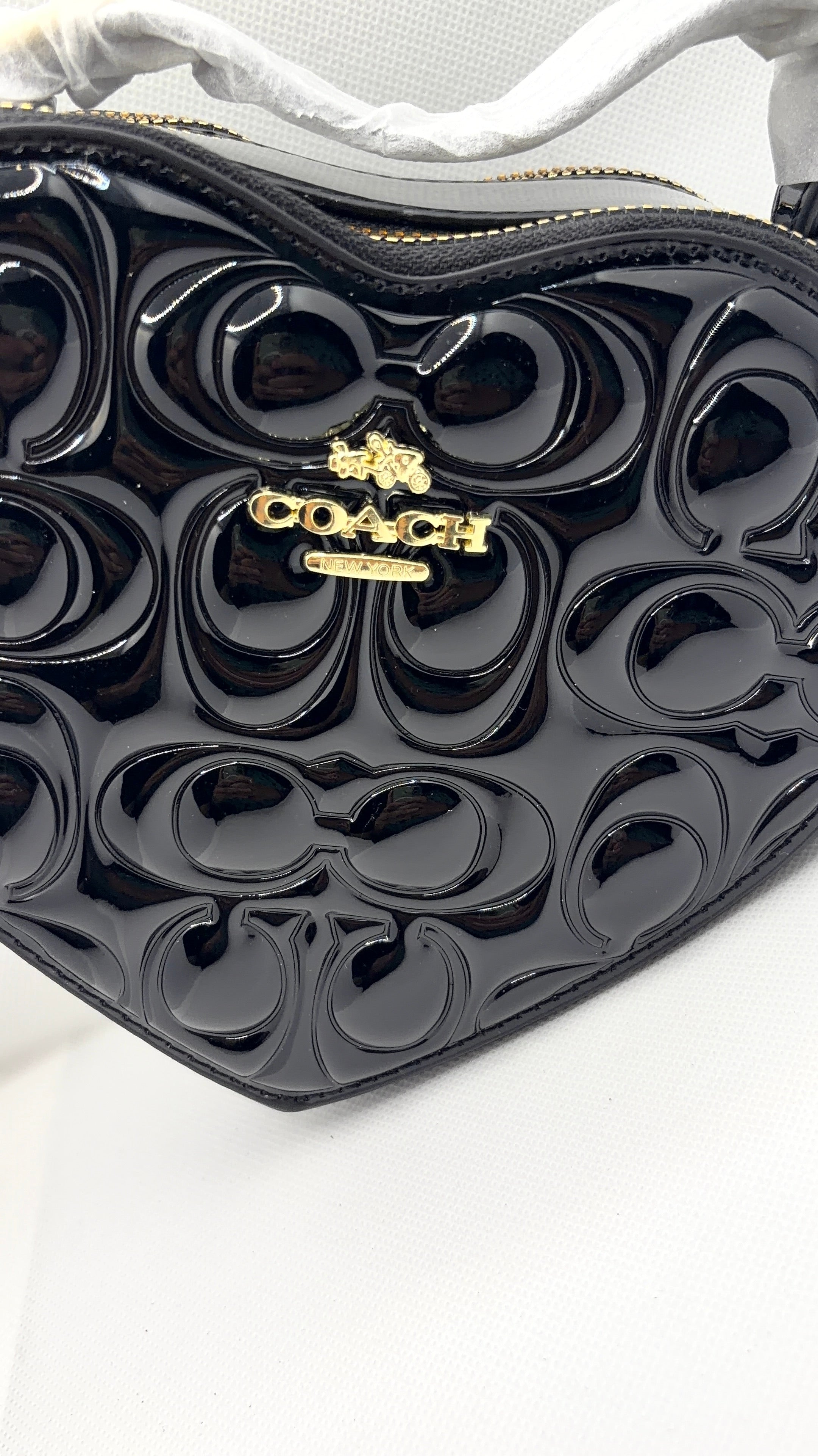 Coach heart bag black patent leather angle view
