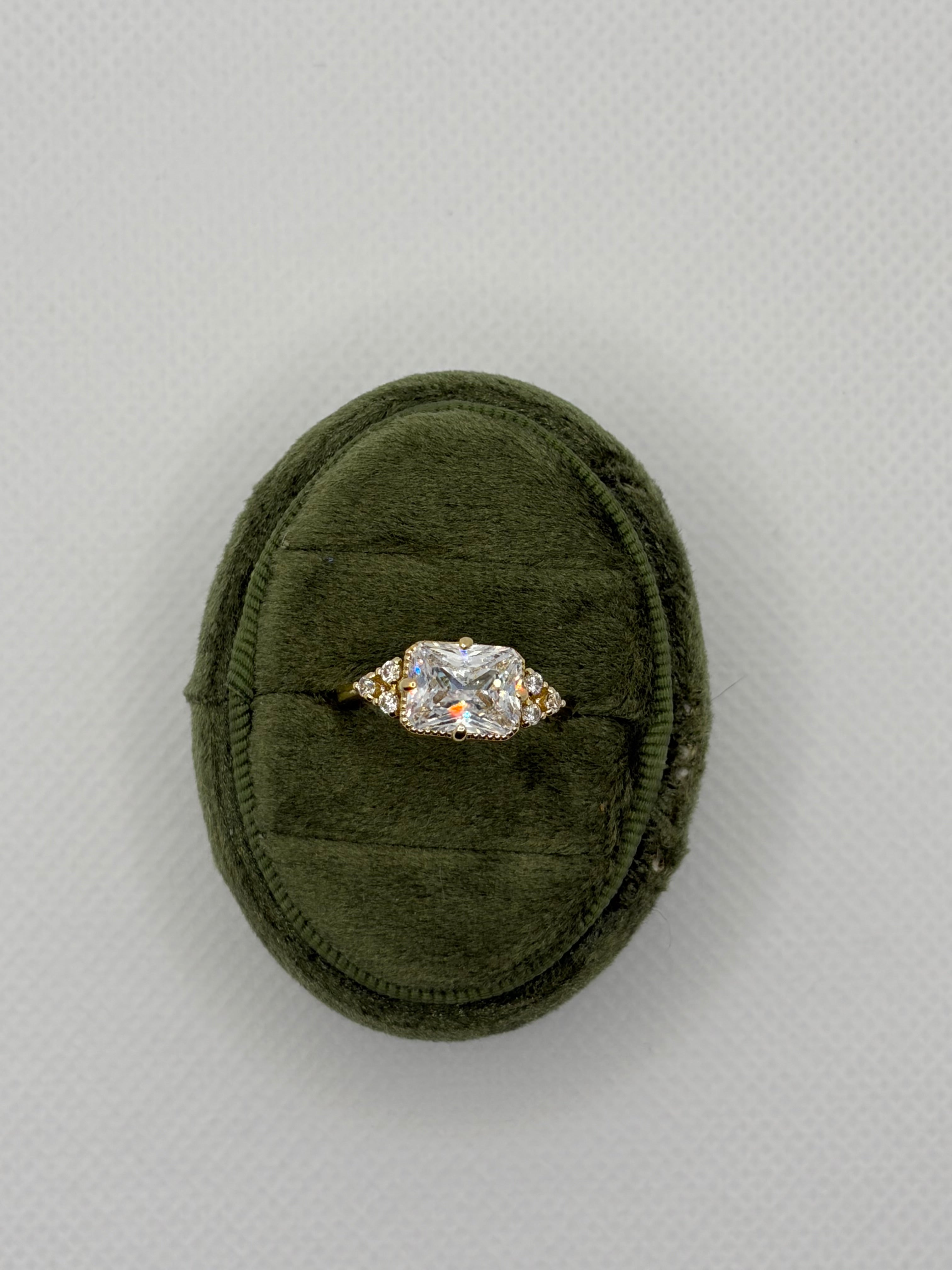 Emerald-Cut Three-Stone Engagement Ring